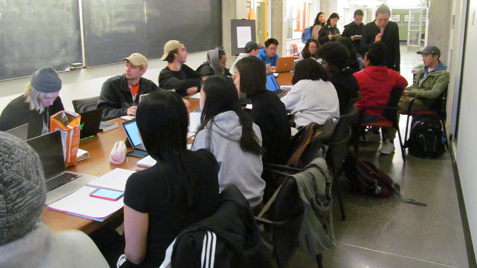 Philosophy graduate students tutor undergraduates in the department’s common space.