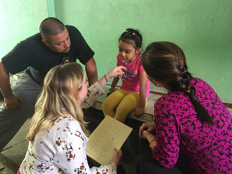 People interacting with child