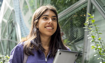 smiling female student in purple sweater